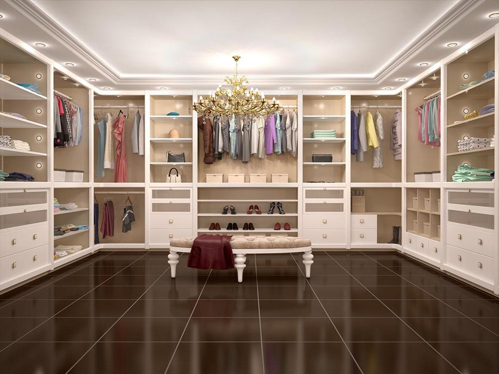 Luxury walk-in closet with chandelier and full clothing display
