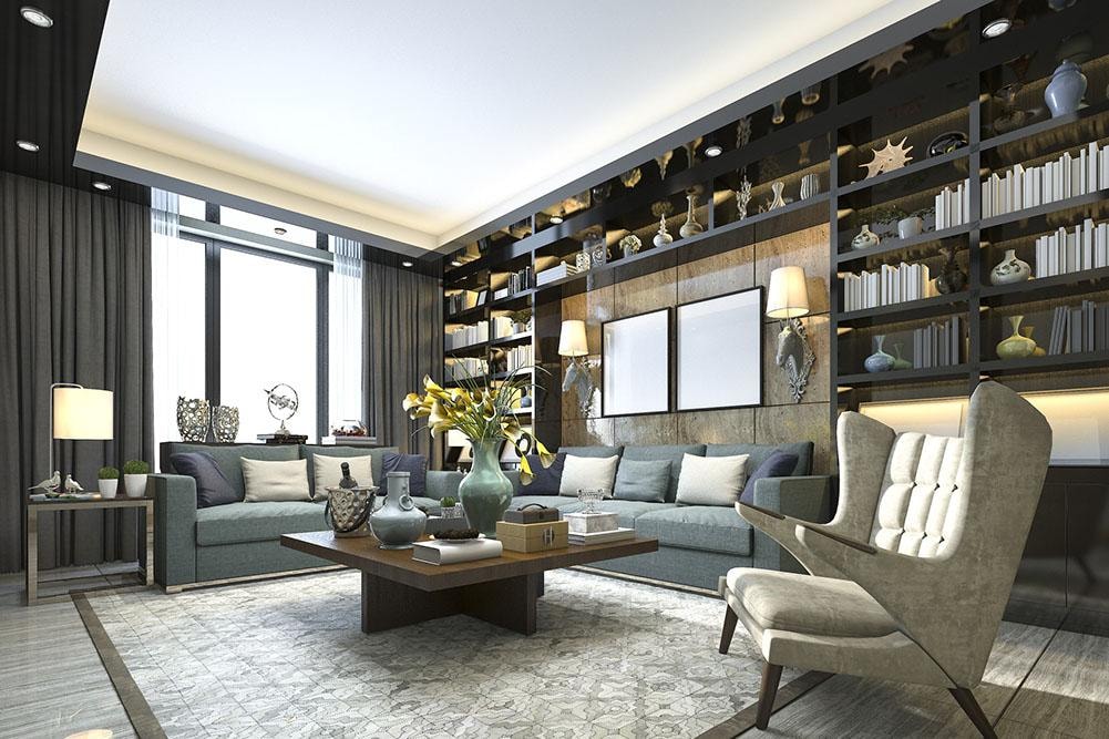 Luxury living room with floor-to-ceiling dark shelving and teal sofas