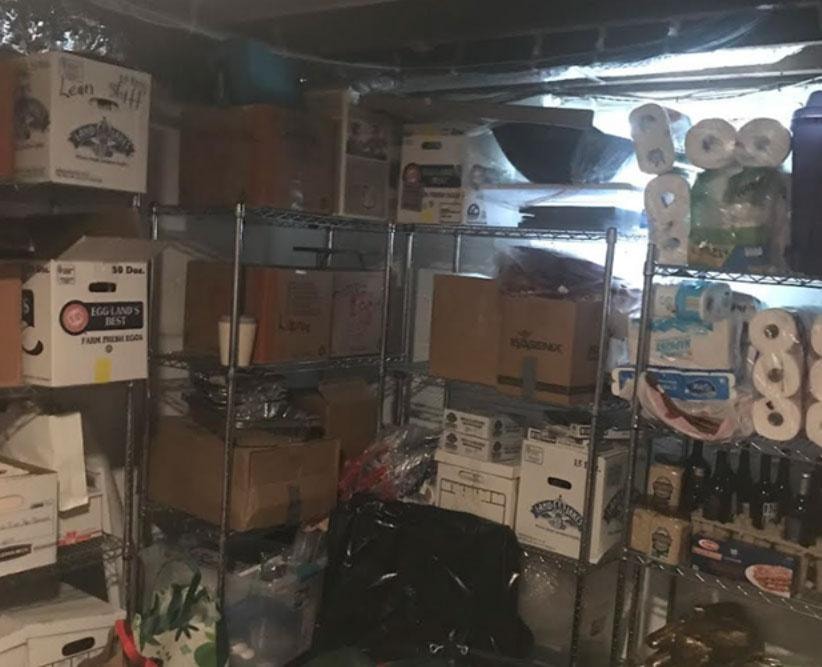 Cluttered storage room before organizing